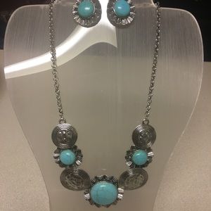 Turquoise and silver necklace.